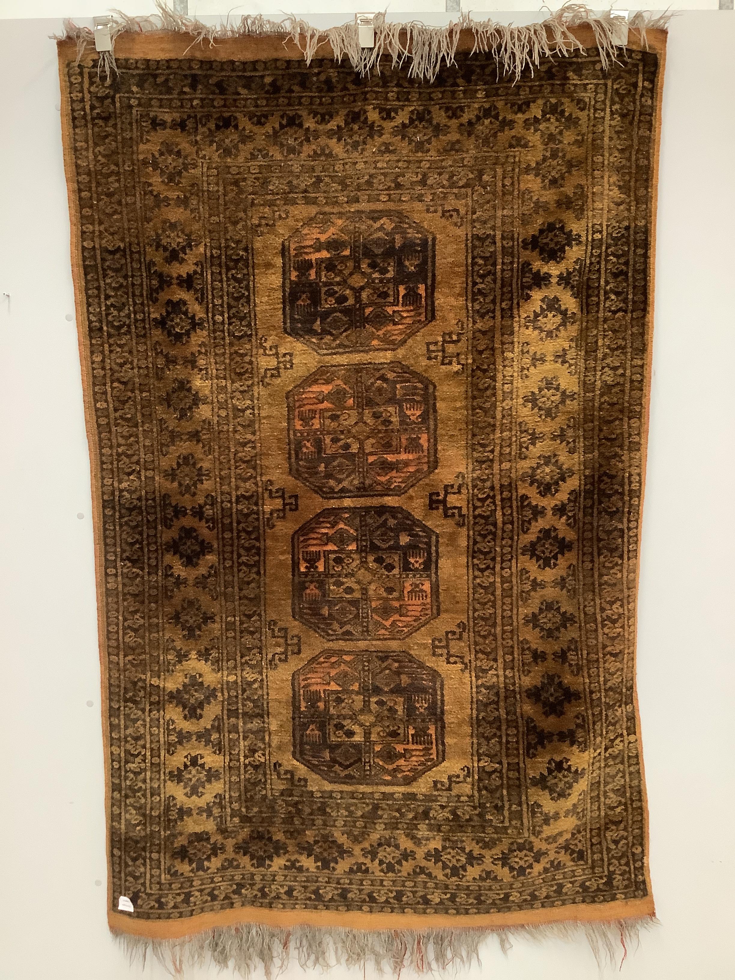 An Afghan gold ground rug, 196 x 125cm